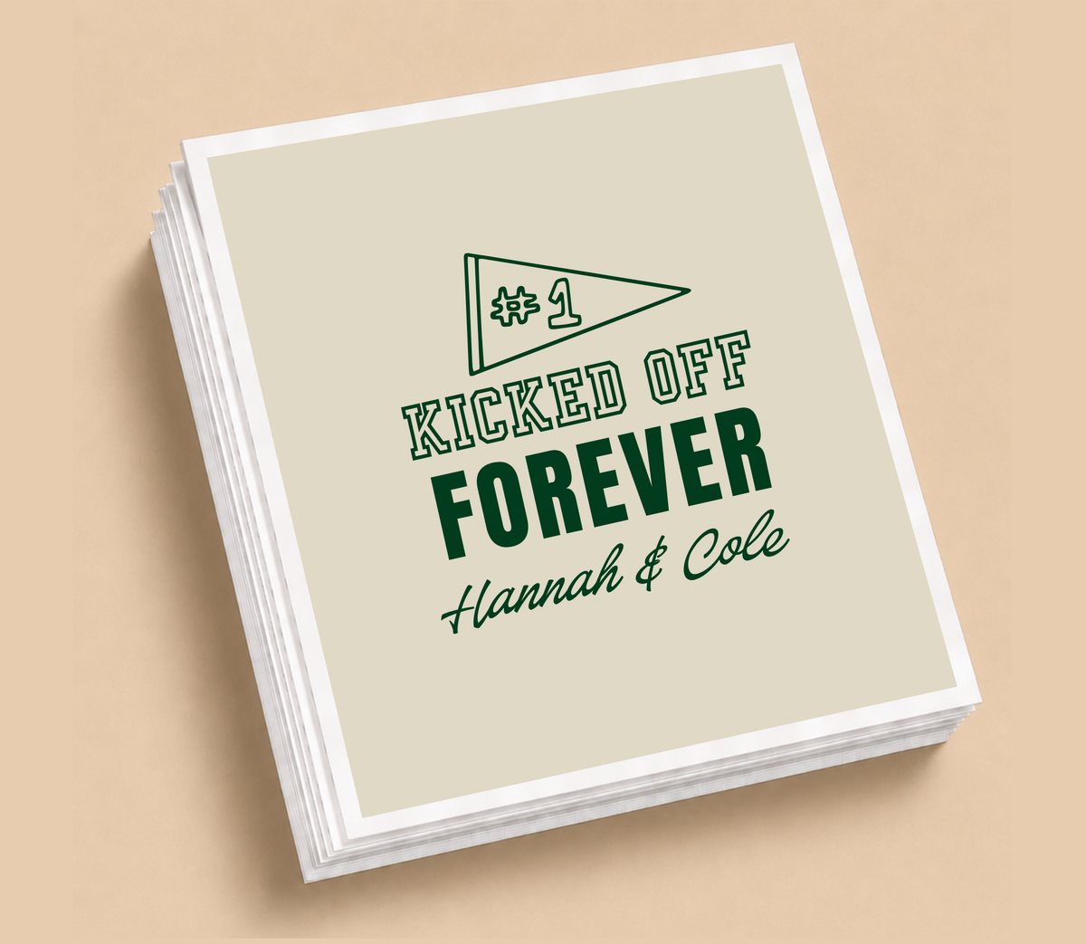 Personalized Kicked Off Forever football wedding napkins featuring a #1 football pennant, deep green lettering, neutral background, and custom couple names.