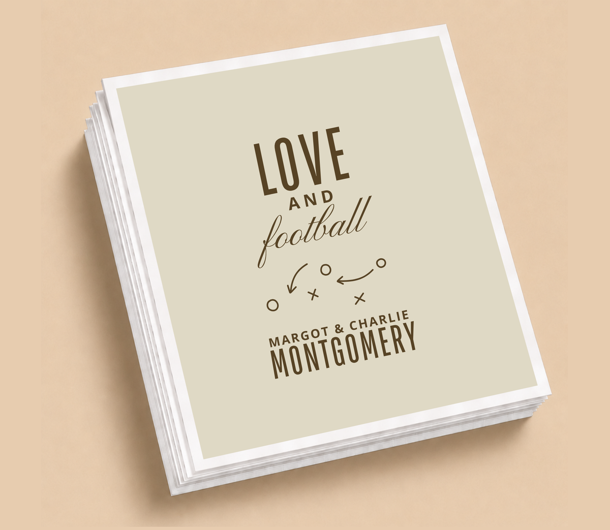 Personalized Love and Football wedding napkins featuring football playbook Xs and Os, brown lettering, neutral background, and custom couple names.
