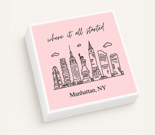 Personalized Manhattan wedding cocktail napkins featuring a New York City skyline illustration and custom wording.
