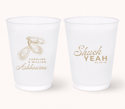 Personalized frosted wedding cups featuring elegant oyster illustrations, custom couple names, family name, and wedding date for coastal and beach wedding celebrations.