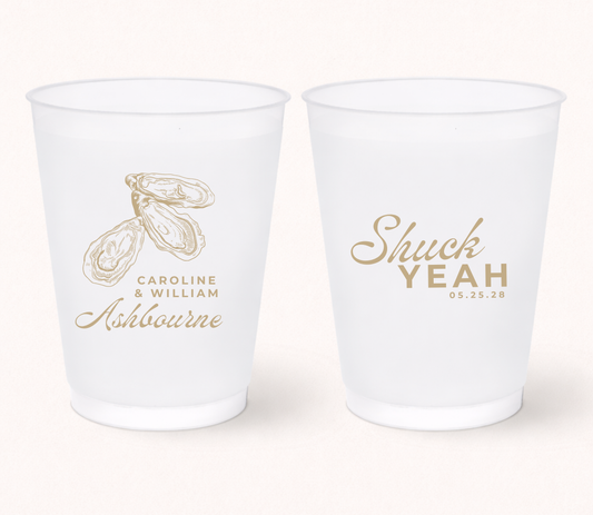 Personalized frosted wedding cups featuring elegant oyster illustrations, custom couple names, family name, and wedding date for coastal and beach wedding celebrations.