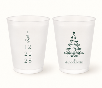 Personalized Christmas wedding frosted cups featuring a Christmas ornament, custom wedding date, Christmas tree, and family name.