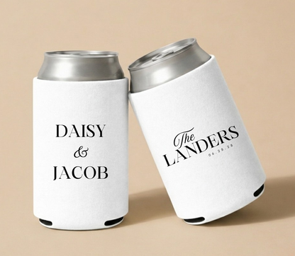 Personalized white wedding can coolers featuring custom couple names, family name, and wedding date in elegant black typography for modern wedding celebrations.
