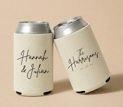 Personalized beige wedding can coolers featuring Hannah and Julian in handwritten script with The Harrisons family name and wedding date in black ink.
