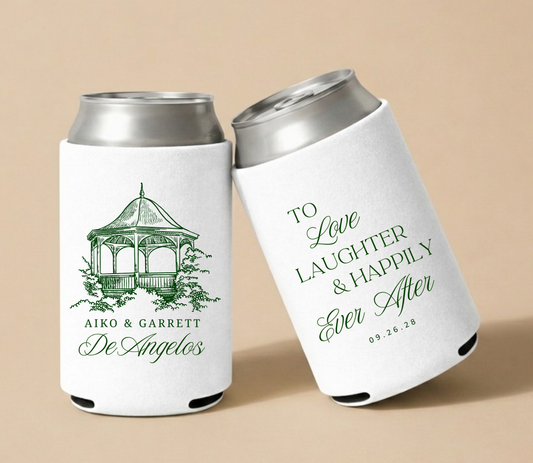 White personalized wedding can coolers featuring an elegant gazebo illustration, couple names Aiko and Garrett, family name DeAngelos, and wedding date.
