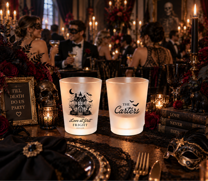 Clear personalized wedding shot glass featuring The Carters surname with black flying bat accents.