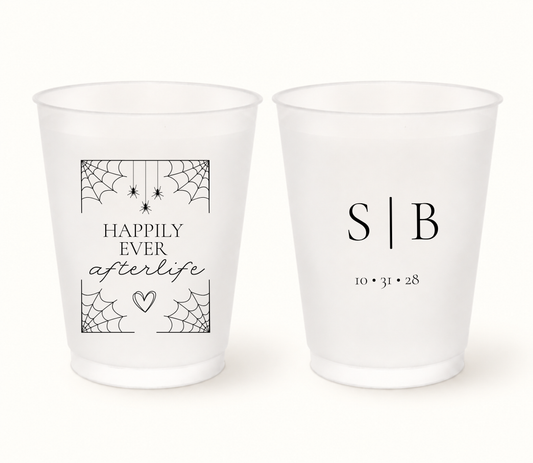 Personalized Happily Ever Afterlife frosted Halloween wedding cups featuring black spiderwebs, hanging spiders, S and B initials, and wedding date 10.31.28.