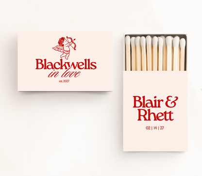 Personalized In Love wedding matchboxes with custom names, wedding date, and red typography on white matchboxes