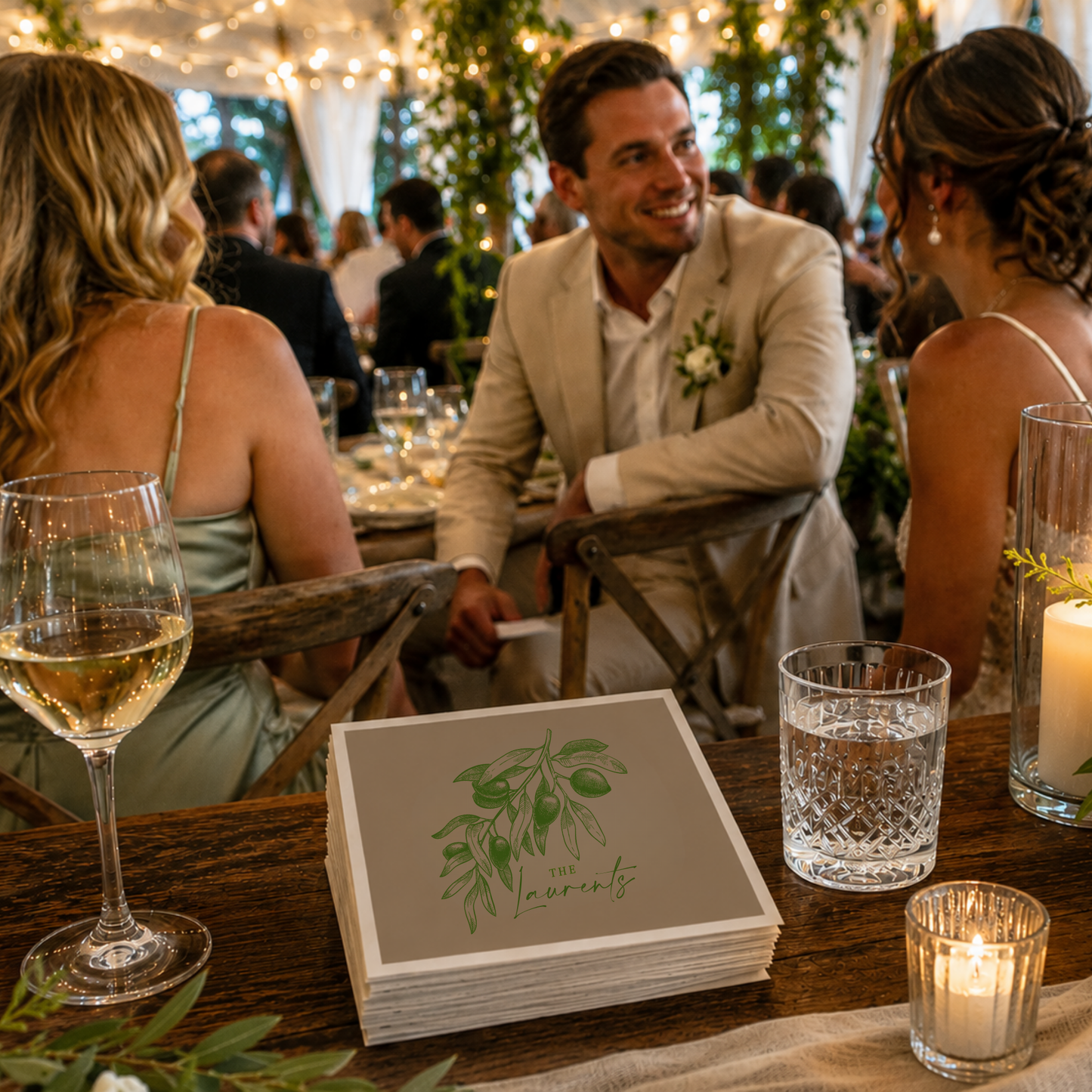 
Taupe personalized olive wedding cocktail napkins featuring an elegant olive branch illustration, custom family surname Laurents, and wedding date.