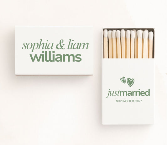 White personalized Just Married wedding matchboxes featuring elegant green typography, custom couple names, wedding date, minimalist heart illustrations, and premium safety matches.
Personalized Just Married wedding matchbox featuring minimalist typography and custom couple names.
Custom wedding matchbox with Just Married design, wedding date, and elegant green typography.