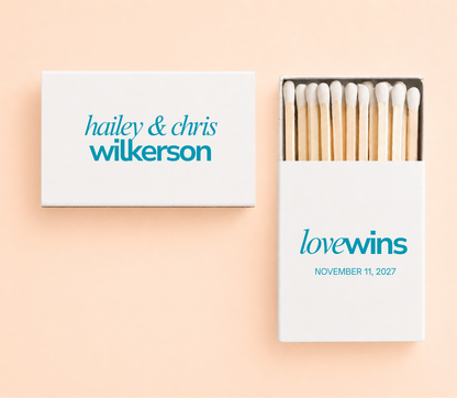 Personalized Love Wins wedding matchboxes with custom names, wedding date, and teal typography on white matchboxes