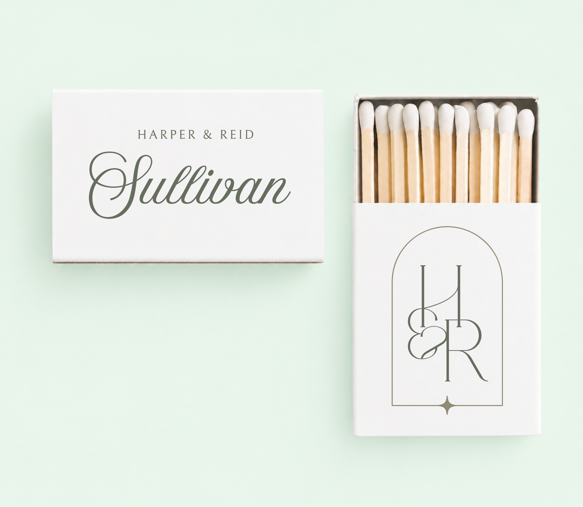 Personalized monogram wedding matchboxes with custom names, wedding date, and black framed initials on white matchboxes