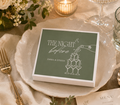 Custom rehearsal dinner napkins with The Night Before wording, champagne tower artwork, and personalized couple names