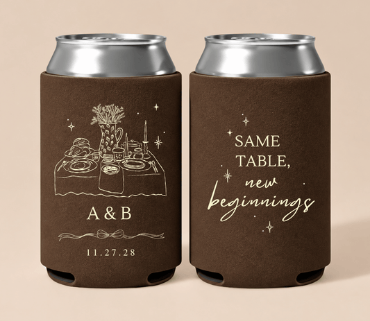 Personalized brown Thanksgiving wedding can coolers featuring a dinner table illustration, custom couple initials, “Same Table, New Beginnings” wording, and wedding date.