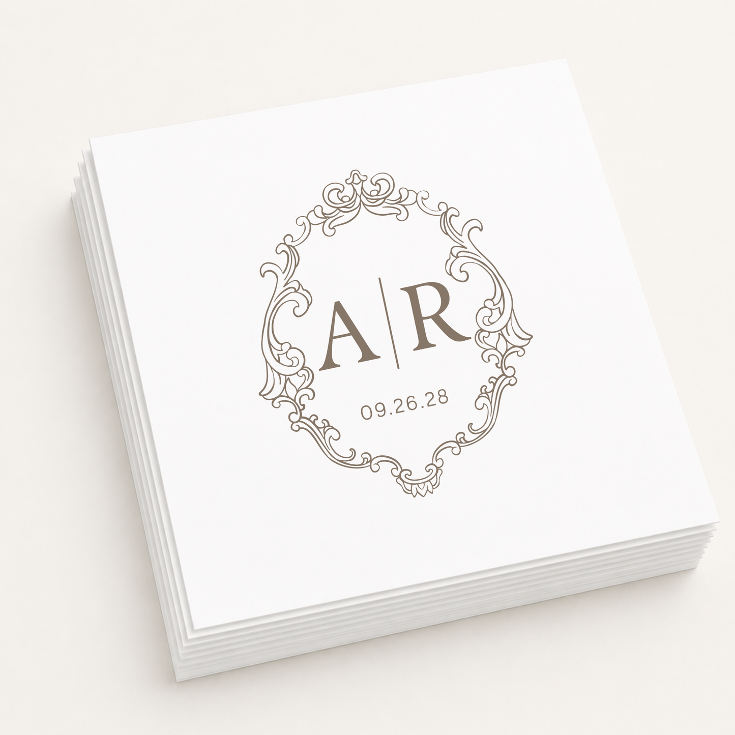 White personalized wedding cocktail napkins featuring an elegant vintage monogram frame, custom initials A and R, and wedding date 09.26.28.