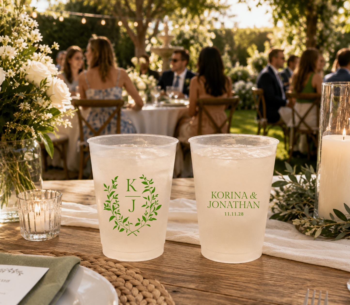 Elegant reusable wedding cup with botanical greenery monogram and personalized names.