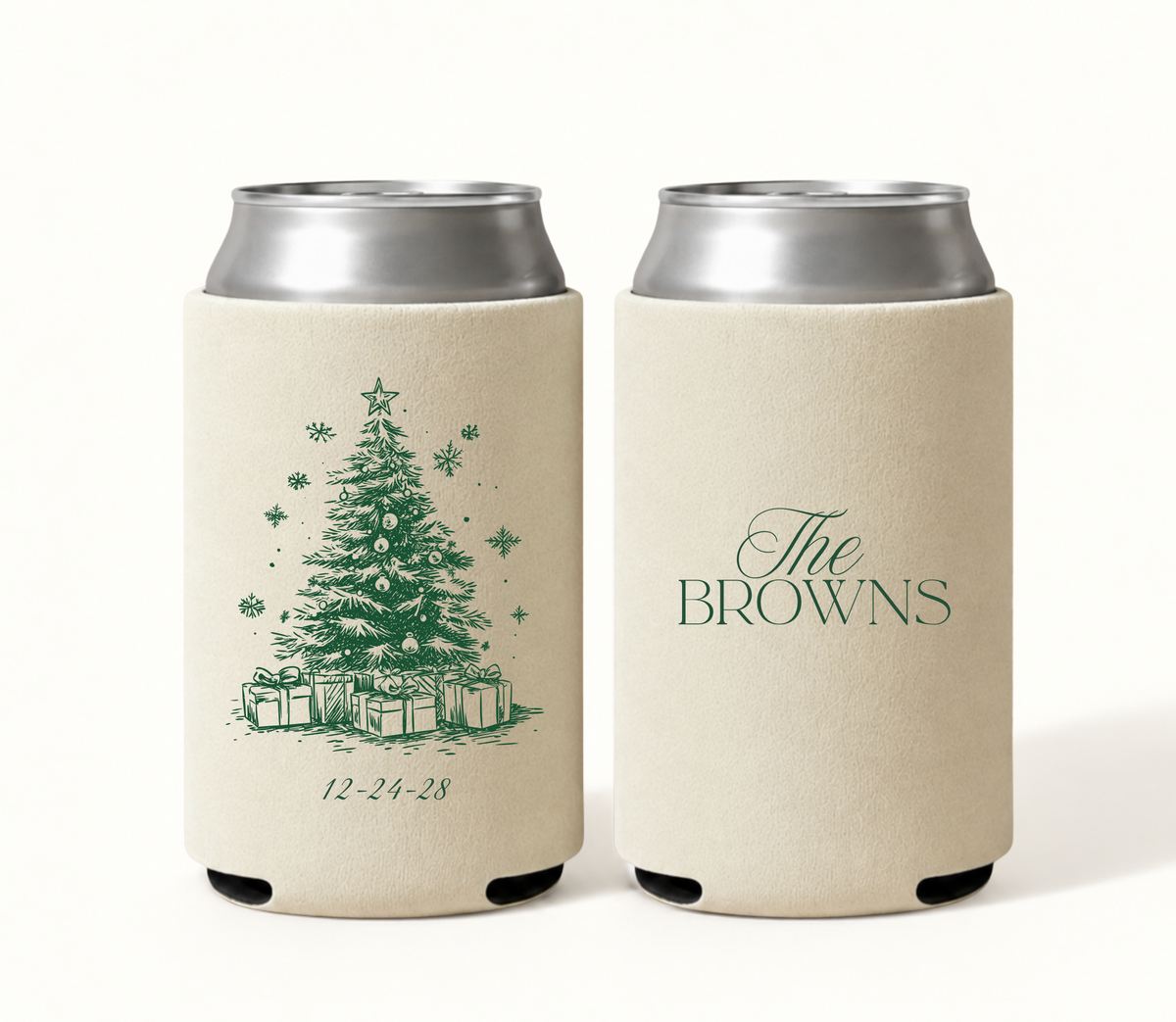 Personalized cream Christmas wedding can coolers featuring green Christmas tree artwork, snowflakes, ornaments, wrapped presents, custom family name, and wedding date.