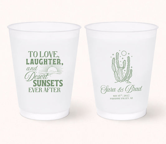 Two personalized frosted wedding cups featuring the phrase "To Love, Laughter, and Desert Sunsets Ever After" with a sunset illustration on one side and a cactus design with Clara & Brad, May 16, 2027, Paradise Valley, Arizona on the reverse.
Personalized desert wedding frosted cup featuring a cactus illustration and custom couple names.
Southwest wedding drink cup with minimalist cactus artwork and personalized wedding details.