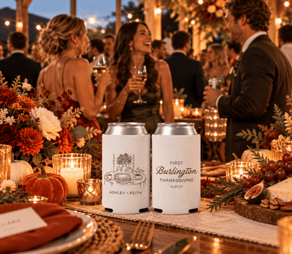 First Thanksgiving wedding favors featuring personalized white can coolers with seasonal flowers, candles, and pie illustration.