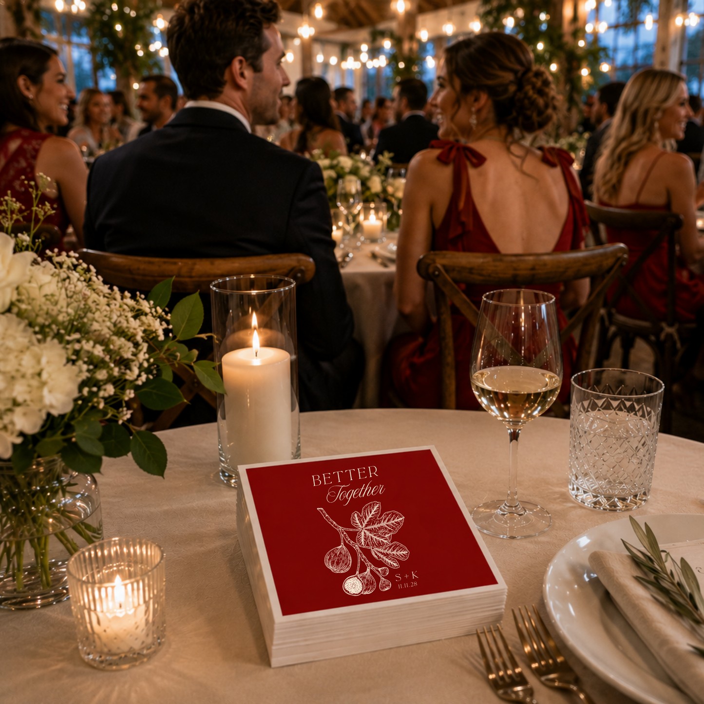 
Red Mediterranean wedding napkin featuring elegant fig branch botanical artwork.
