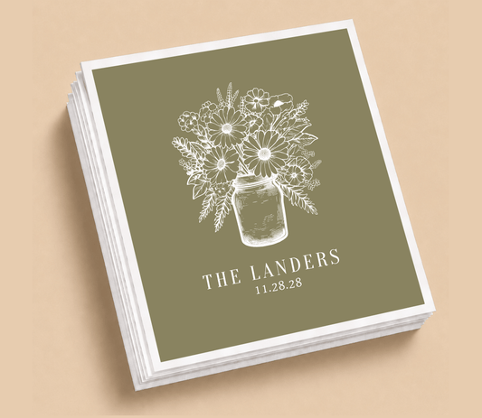Personalized floral mason jar Thanksgiving wedding table napkins featuring a white wildflower bouquet, custom family name, and wedding date on an olive green background.