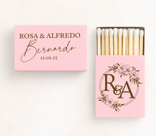 Personalized floral monogram wedding matchboxes featuring custom couple names, family name, wedding date, and floral wreath initials.
