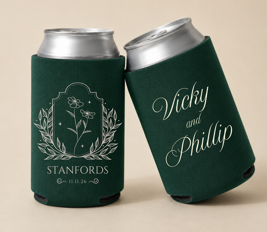 Dark green personalized wedding can coolers featuring elegant wildflower botanical artwork, custom couple names Vicky and Phillip, the family name Stanfords, and wedding date.
