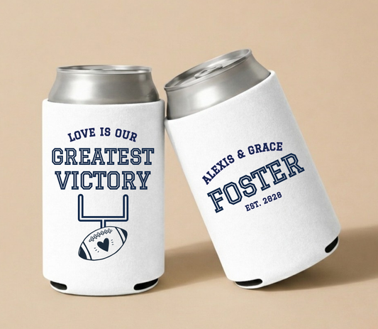Personalized Greatest Victory Football Wedding Can Coolers featuring football and heart artwork, custom couple names, and wedding details.
