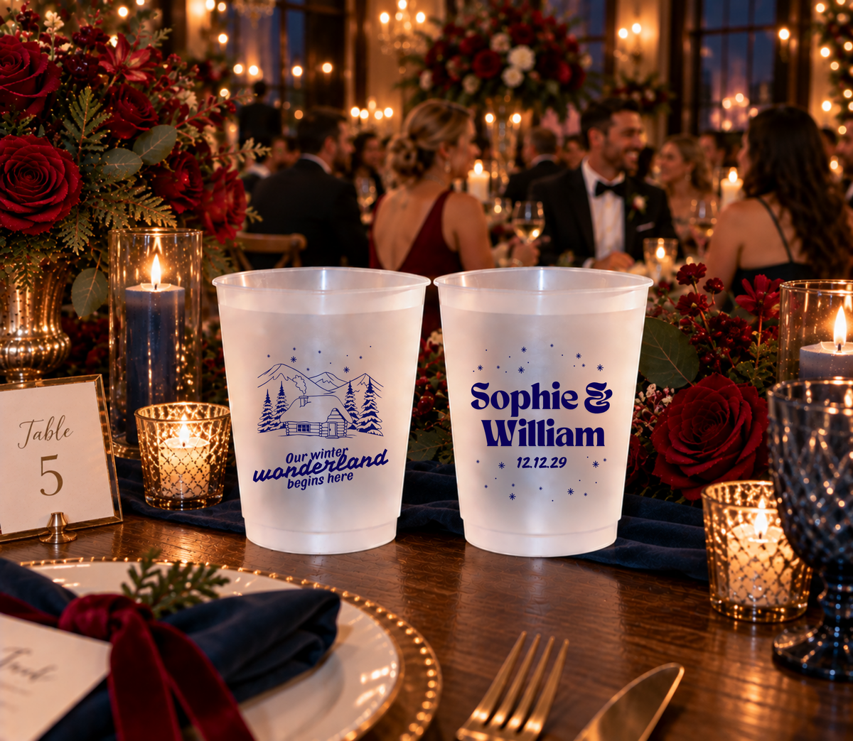 Winter wonderland wedding drink cups featuring mountain cabin holiday artwork.
