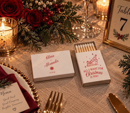 Olivia and Alexander personalized Christmas wedding matchboxes featuring elegant red script names and holiday artwork.