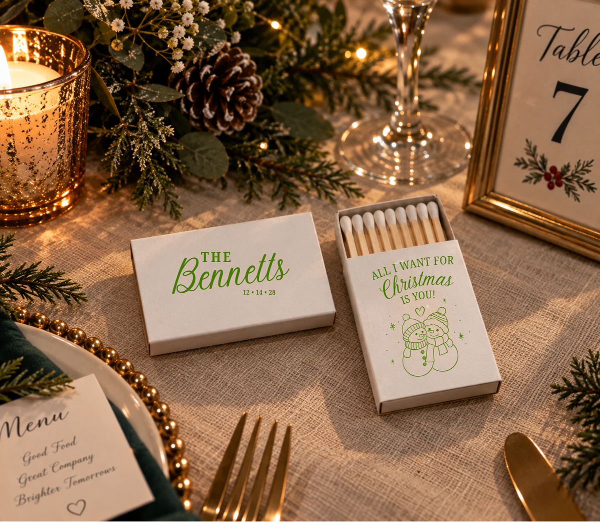 The Bennetts Christmas wedding matchboxes featuring snowman couple artwork and personalized wedding details.