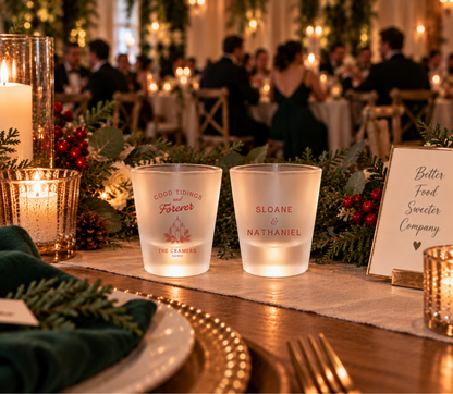 Christmas wedding favor shot glasses with candle illustration, couple names, and wedding date.