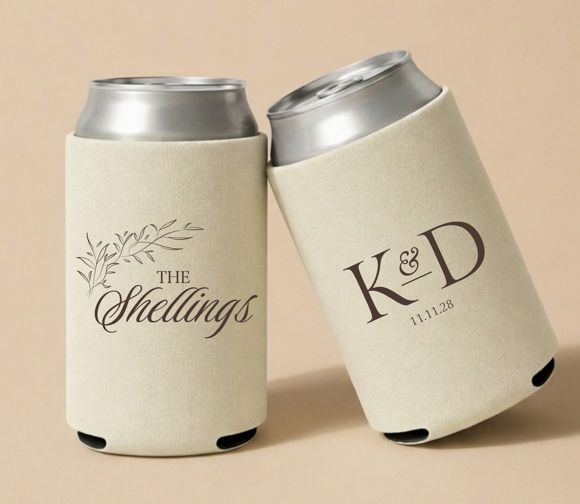Ivory personalized wedding can coolers featuring elegant botanical artwork, the family name Shellings, custom initials K and D, and wedding date in a classic minimalist design.
