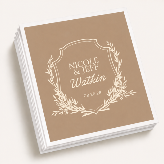 Taupe personalized monogram wedding cocktail napkins featuring a botanical crest, custom couple names Nicole and Jeff, family surname Watkin, and wedding date.
