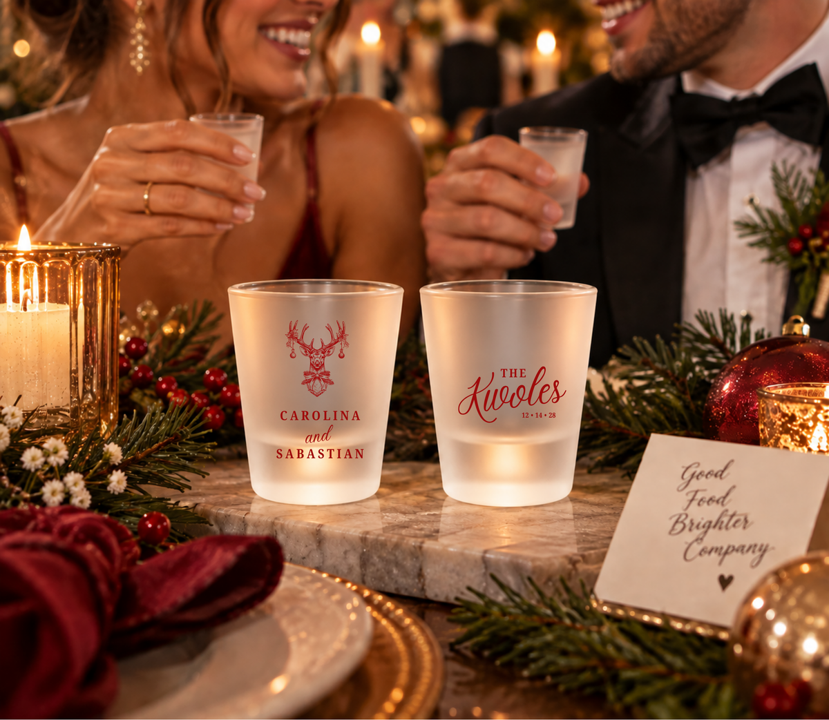 Holiday wedding favor shot glasses featuring Christmas reindeer design and couple details.