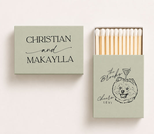 Personalized sage green wedding matchboxes featuring Christian and Makaylla on the cover and a custom dog portrait with cocktail illustration, "The Brooks," and "Cheers, Levi" on the sliding matchbox.