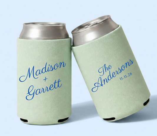 Personalized sage green wedding can coolers featuring Madison and Garrett with The Andersons family name and wedding date in vibrant blue script.