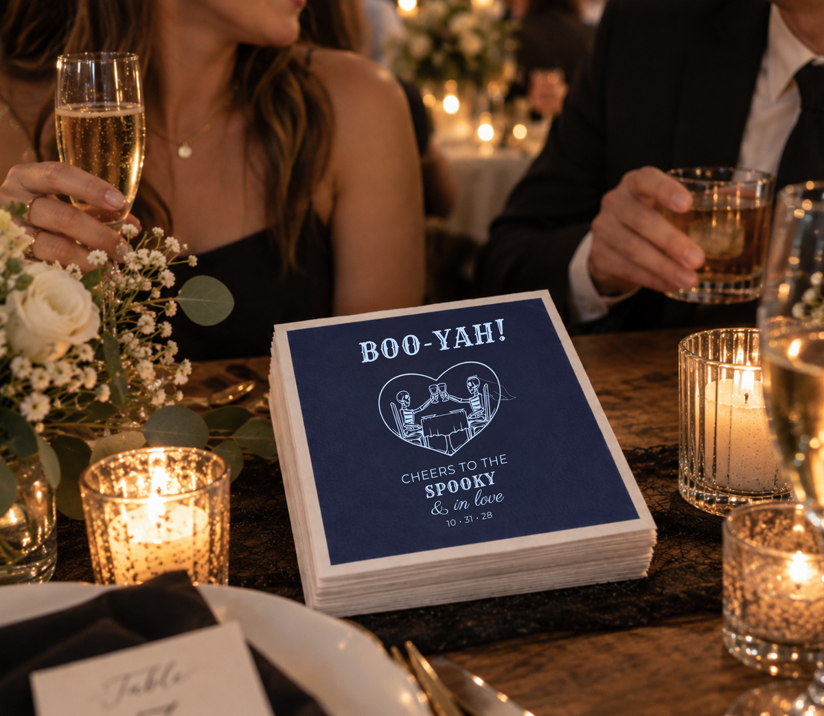 Navy Halloween wedding napkins featuring a skeleton bride and groom raising glasses.