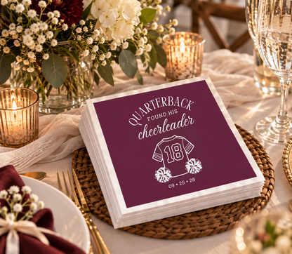 Quarterback and cheerleader themed wedding cocktail napkin featuring romantic typography and football-inspired artwork.