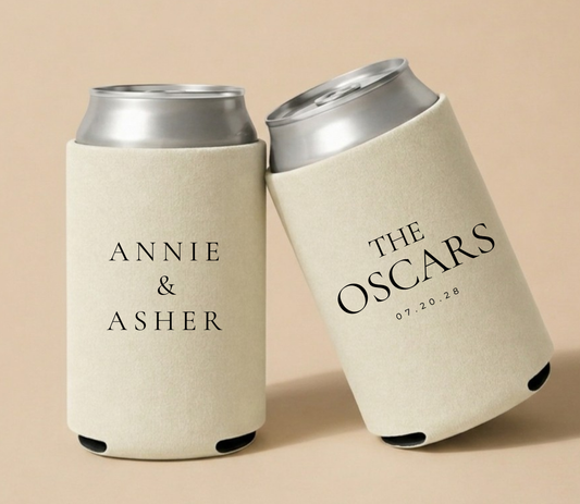 Personalized beige wedding can coolers featuring Annie and Asher with The Oscars family name and wedding date in elegant black serif typography.