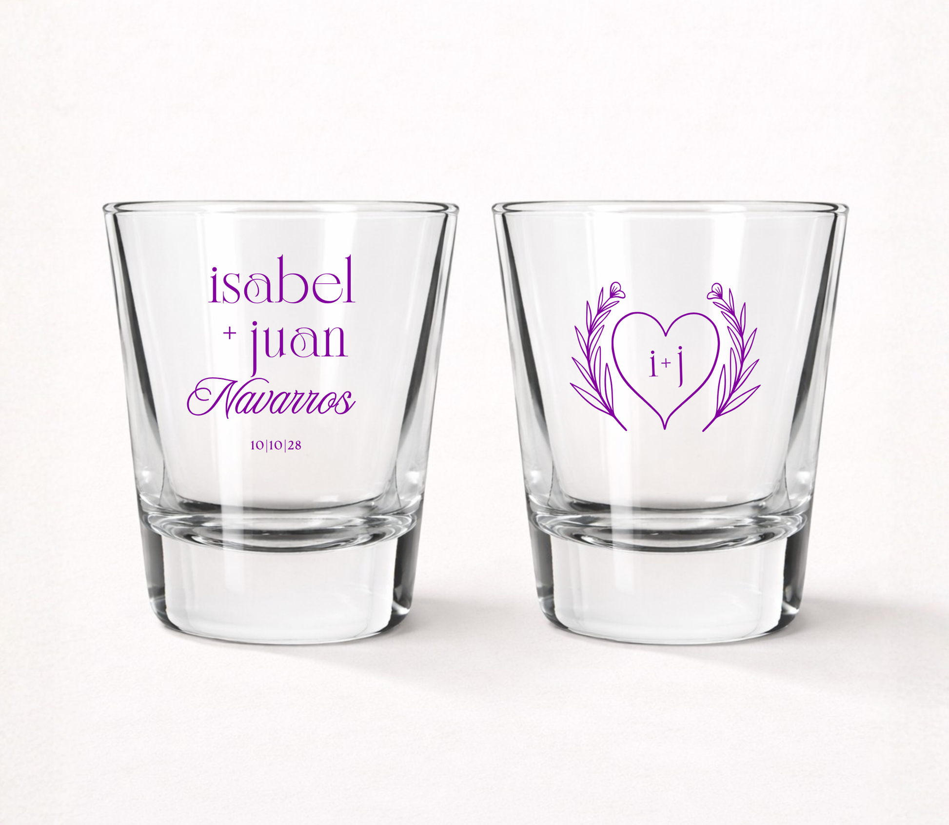 Personalized Heart Monogram wedding shot glasses featuring custom couple names, family name, initials, wedding date, and elegant botanical heart design.