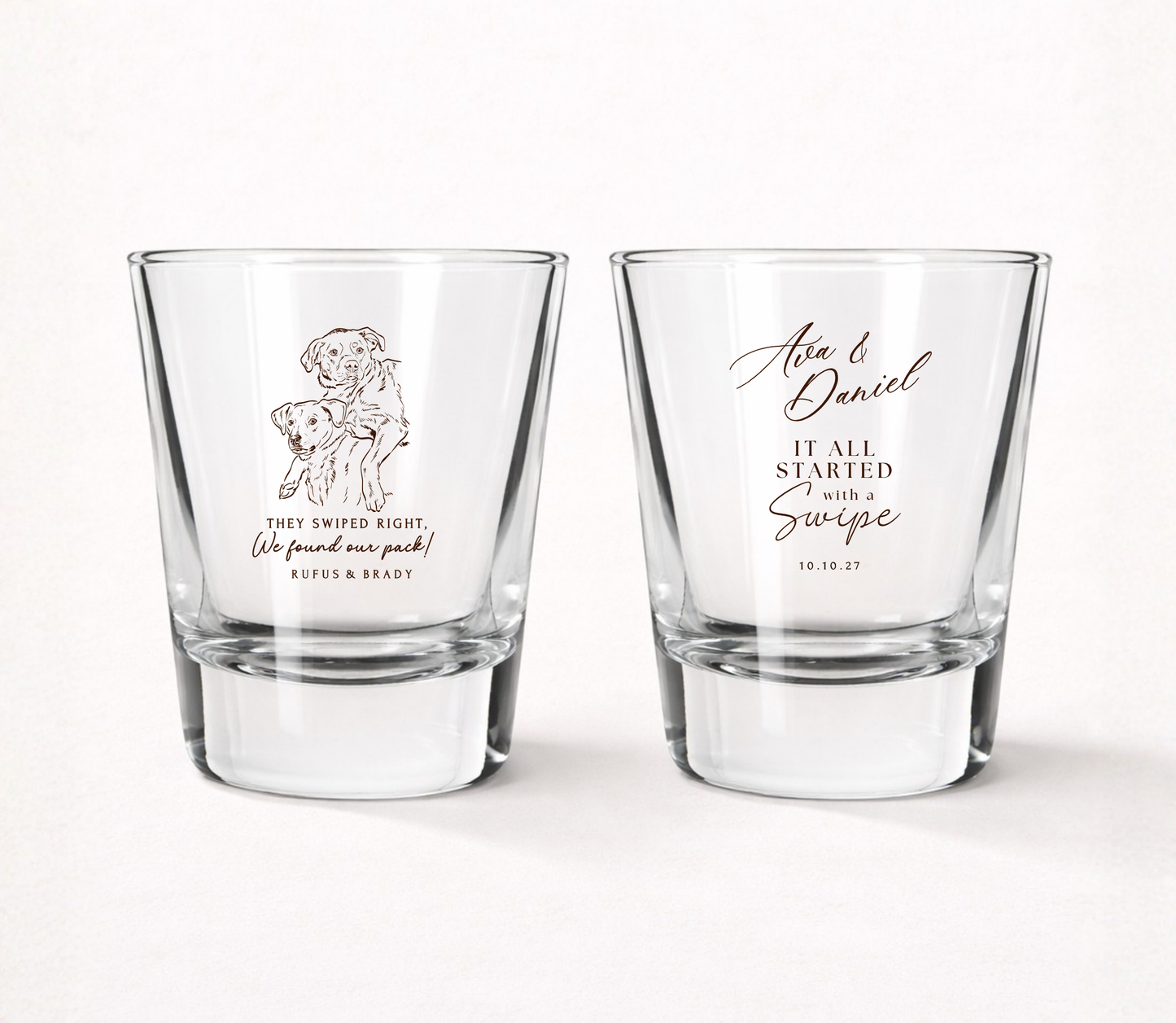 Personalized clear wedding shot glasses featuring a custom dog portrait, swipe love wedding design, couple names, and wedding date.
