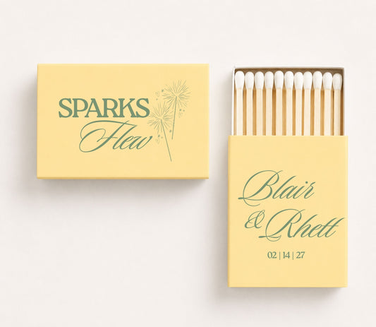 Personalized wedding matchboxes featuring Sparks Flew sparkler artwork with custom names Blair and Rhett and wedding date.