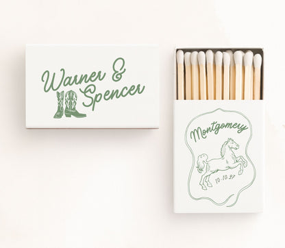 White personalized western boots wedding matchboxes featuring cowboy boot illustrations, elegant green script typography, custom couple names, wedding date, and premium safety matches.
Personalized western wedding matchbox featuring cowboy boots and elegant script typography.
Custom cowboy wedding matchbox with western boot artwork, couple names, and wedding date.
