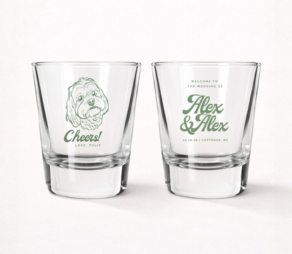 Clear personalized wedding shot glasses featuring a custom dog portrait illustration, pet name, couple names, wedding date, and wedding location.