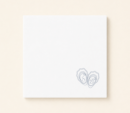 Personalized oyster monogram wedding napkin featuring custom initials inside oyster shell illustrations