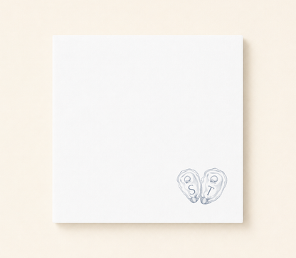 Minimalist oyster shell wedding napkin featuring custom initials inside hand illustrated oyster shells