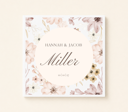 Personalized blush floral wedding napkin with custom family name and wedding date