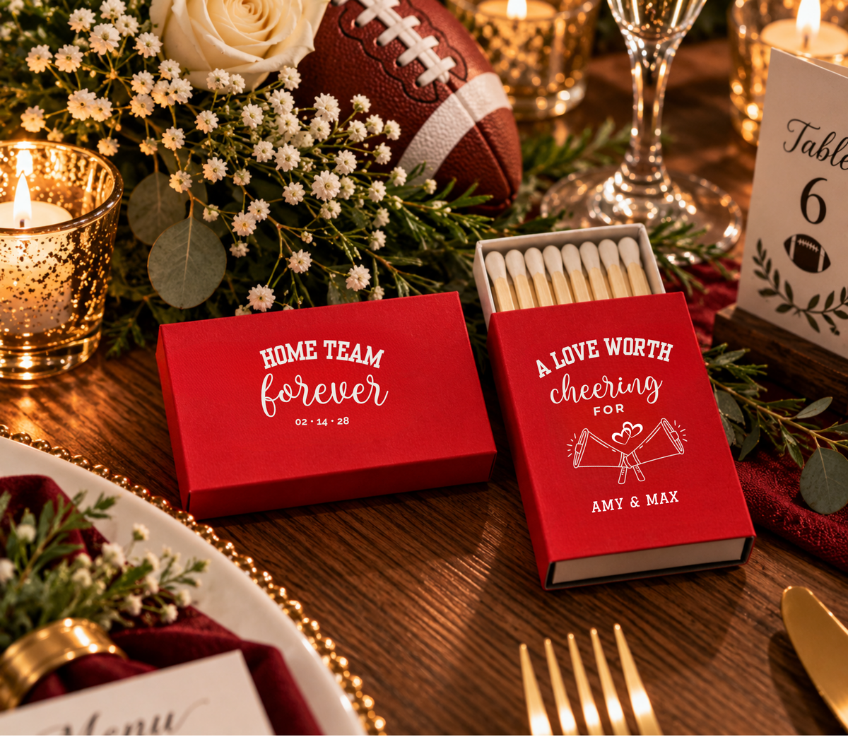 Custom sports wedding matchboxes featuring A Love Worth Cheering For wording, crossed megaphones, and personalized couple names.