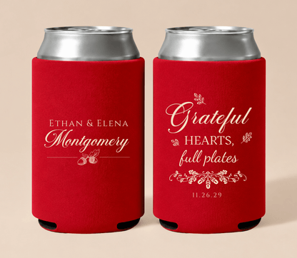 Personalized red Thanksgiving wedding can coolers featuring “Grateful Hearts, Full Plates” wording, custom couple names, wedding date, and botanical accents.